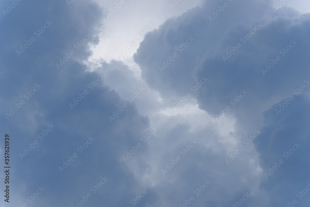 Stormy rain big fluffy clouds. Dark sky. Natural scenic abstract background. Weather changes backdrop. Sky filled with voluminous clouds. Stormy rain big fluffy clouds. Dark sky. Natural scenic abstract background. Weather changes backdrop. Sky filled with voluminous clouds.
