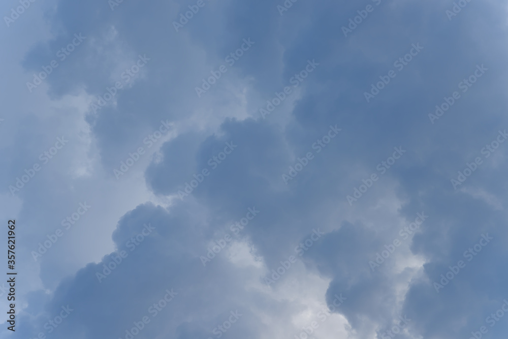 Stormy rain big fluffy clouds. Dark sky. Natural scenic abstract background. Weather changes backdrop. Sky filled with voluminous clouds. Stormy rain big fluffy clouds. Dark sky. Natural scenic abstract background. Weather changes backdrop. Sky filled with voluminous clouds.