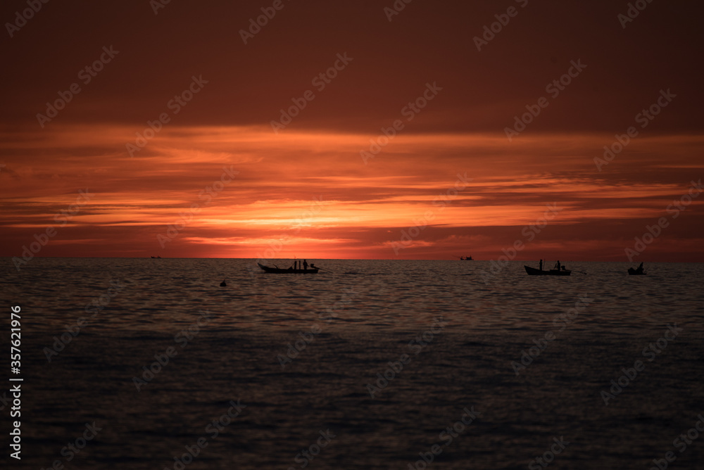boat in sea with sunset  