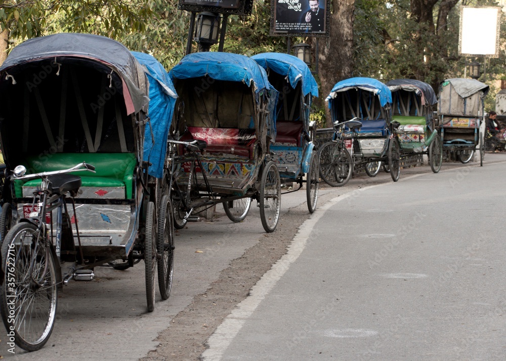 Obraz premium old human pulled rickshaw carriage in the street
