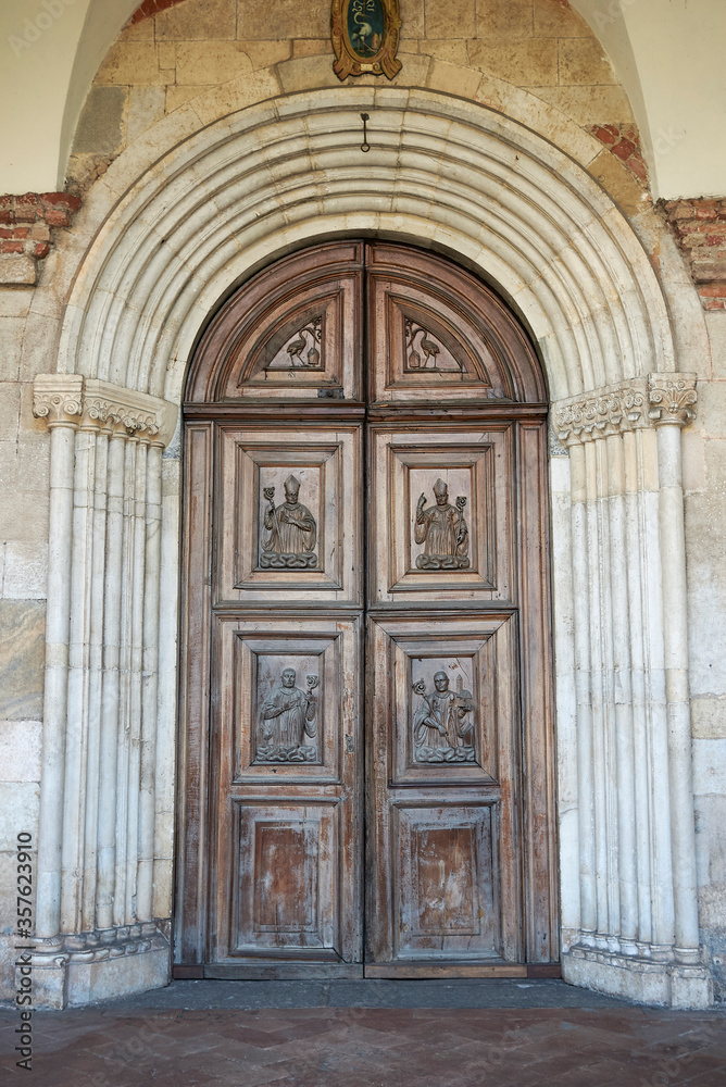 View of Santa Maria di Chiaravalle wood entrance door View of Santa Maria di Chiaravalle wood entrance door