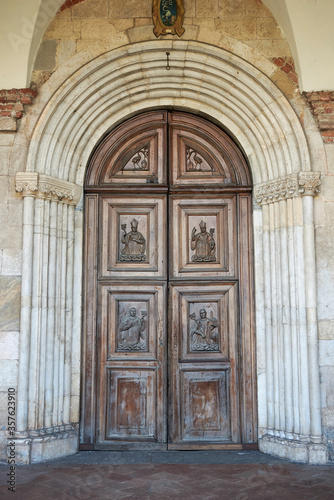 View of Santa Maria di Chiaravalle wood entrance door