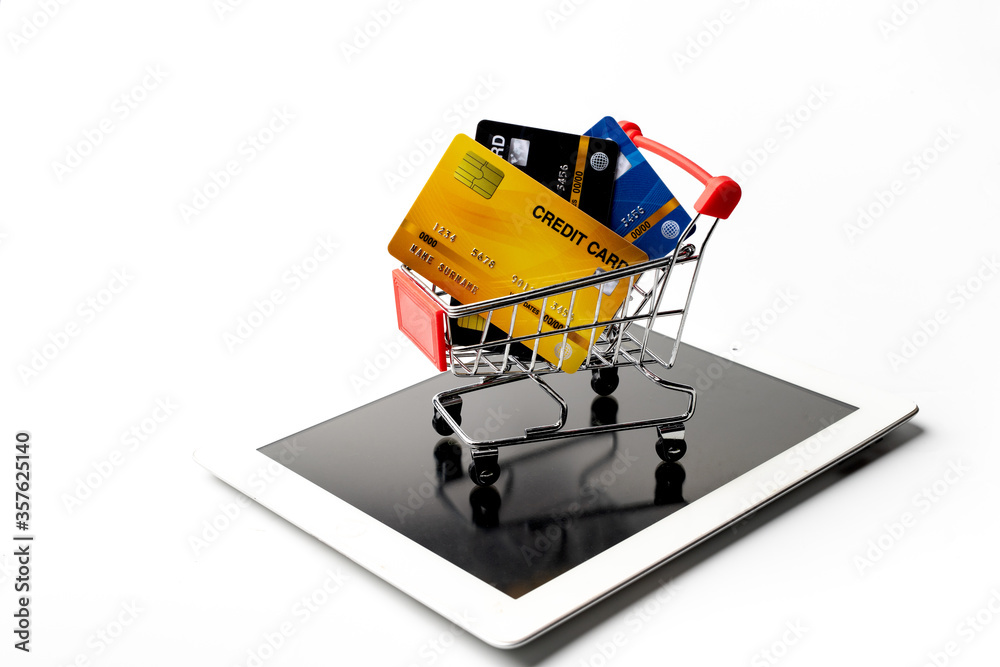 tablet pc with a credit card and a shopping cart tablet pc with a credit card and a shopping cart