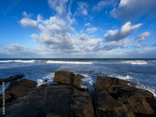 Rocky seascape with clouds in the sky 