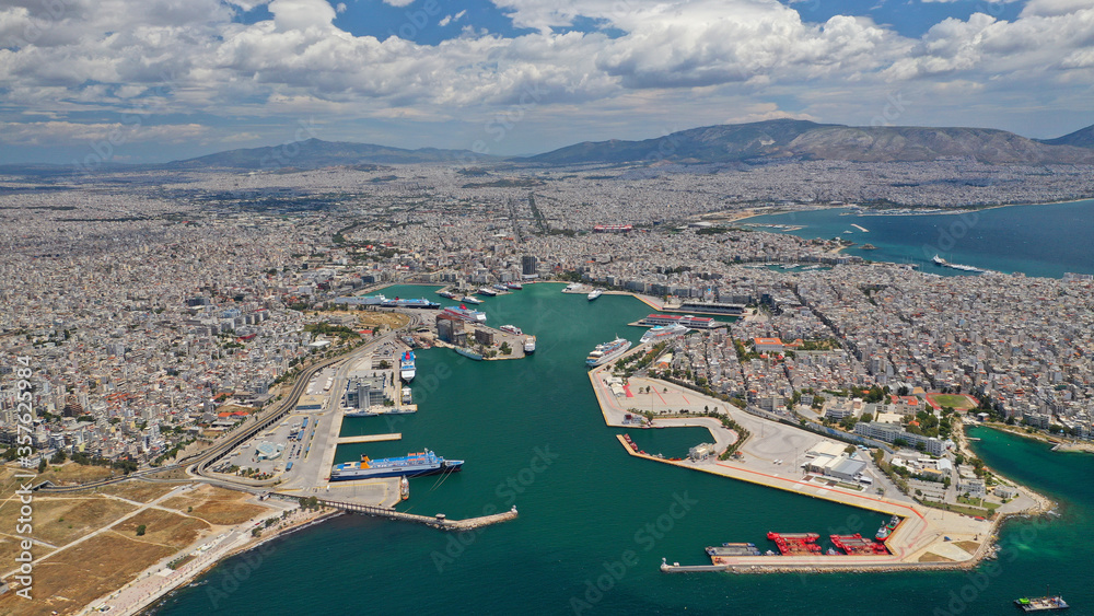 Aerial drone panoramic photo of famous port of Pireus or Piraeus where passenger ferries and cruises travel to popular Aegean island destinations as seen from high altitude, Attica, Greece