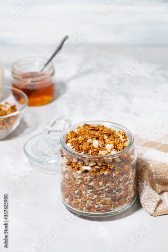 homemade granola with coconut and nuts, vertical