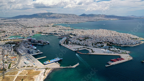 Aerial drone panoramic photo of famous port of Pireus or Piraeus where passenger ferries and cruises travel to popular Aegean island destinations as seen from high altitude  Attica  Greece