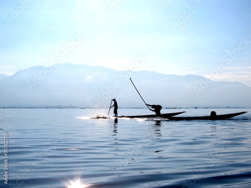 Traditional Fishermen on Boat  Inle Lake  Myanmar  Burma 