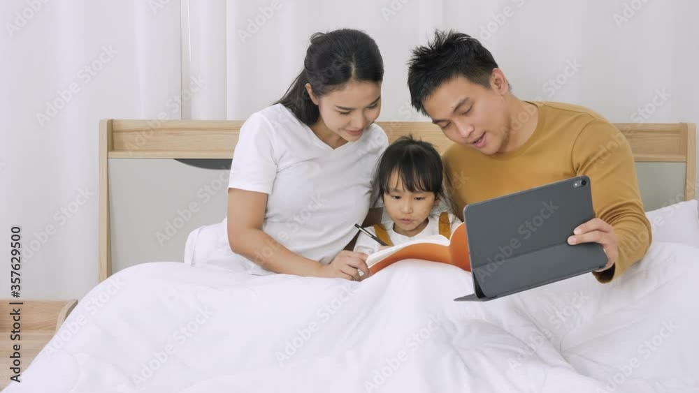 Asian family study online with digital tablet in the home Asian family study online with digital tablet in the home