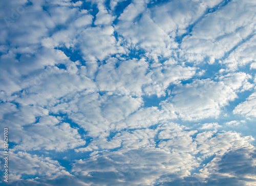 White clouds against a blue sky.