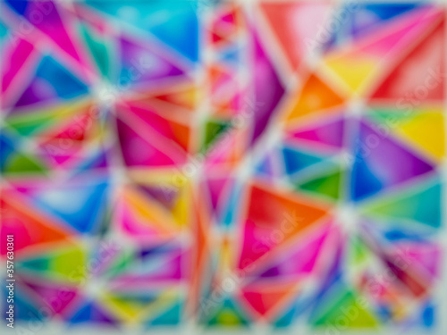 Blurry Hand painted colorful watercolor triangle pattern with white line in between.