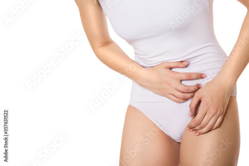 body of a woman. Pain in the lower abdomen. Copycpase on a white background