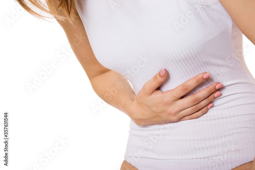 Wallpaper Mural Stomachache. body of a woman. Pain in the upper abdomen. Copyspace on white background Torontodigital.ca