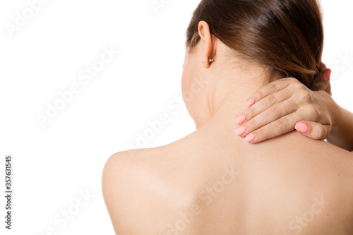 woman back pain neck pain. Back view. Copycpase