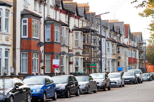 Property Sales. Estate Agents Signs on UK Terraced Houses