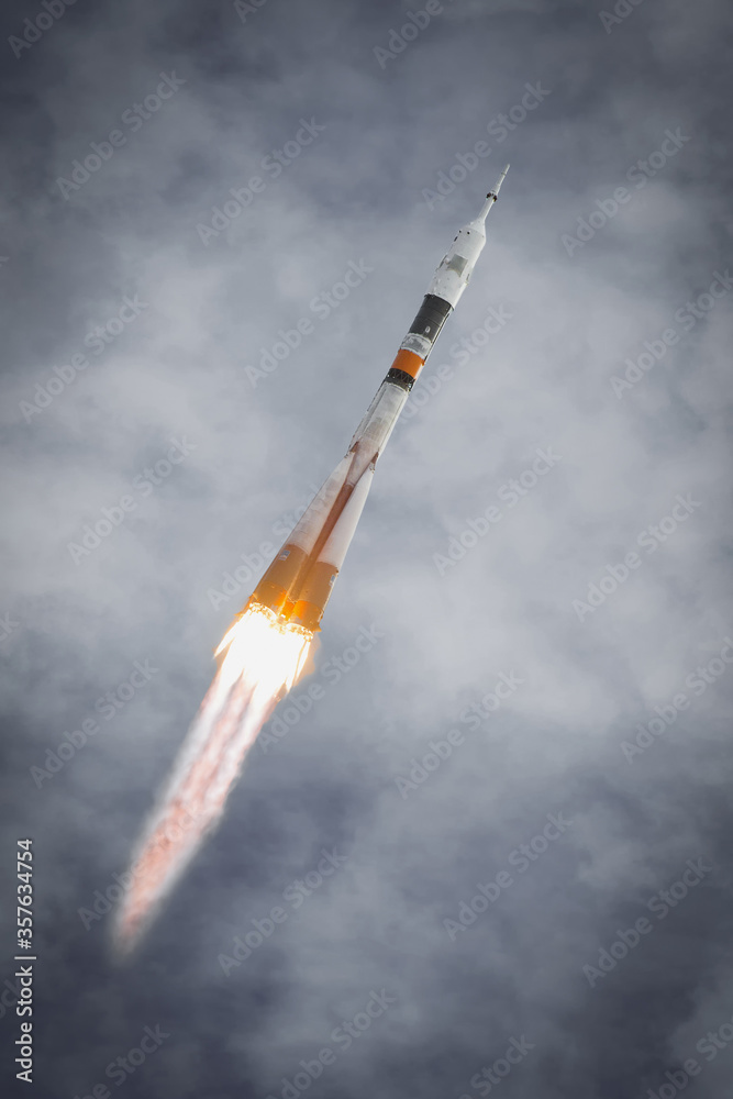 Rocket takes off into the sky. The elements of this image furnished by NASA.