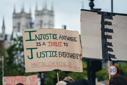 Black Lives Matter protest in London. Injustice banner