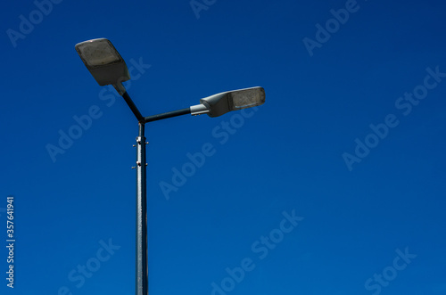 A modern street LED lighting pole. Urban electro-energy technologies. Savings on street urban road lighting. Energy saving. High tech. Eco-friendly smart city system.