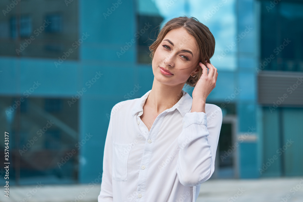 Businesswoman successful woman business person standing outdoor corporate building exterior. Pensiv caucasian confidence professional business woman middle age Businesswoman successful woman business person standing outdoor corporate building exterior. Pensiv caucasian confidence professional business woman middle age