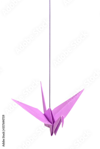 Origami bird hang over white