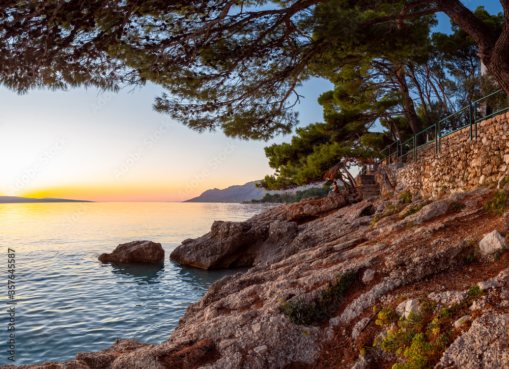 sunset over the Adriatic Sea and the coastline in Brela, Croatia sunset over the Adriatic Sea and the coastline in Brela, Croatia