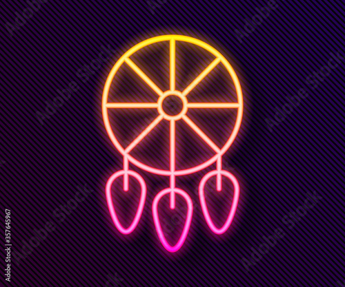 Glowing neon line Dream catcher with feathers icon isolated on black background. Vector Illustration.