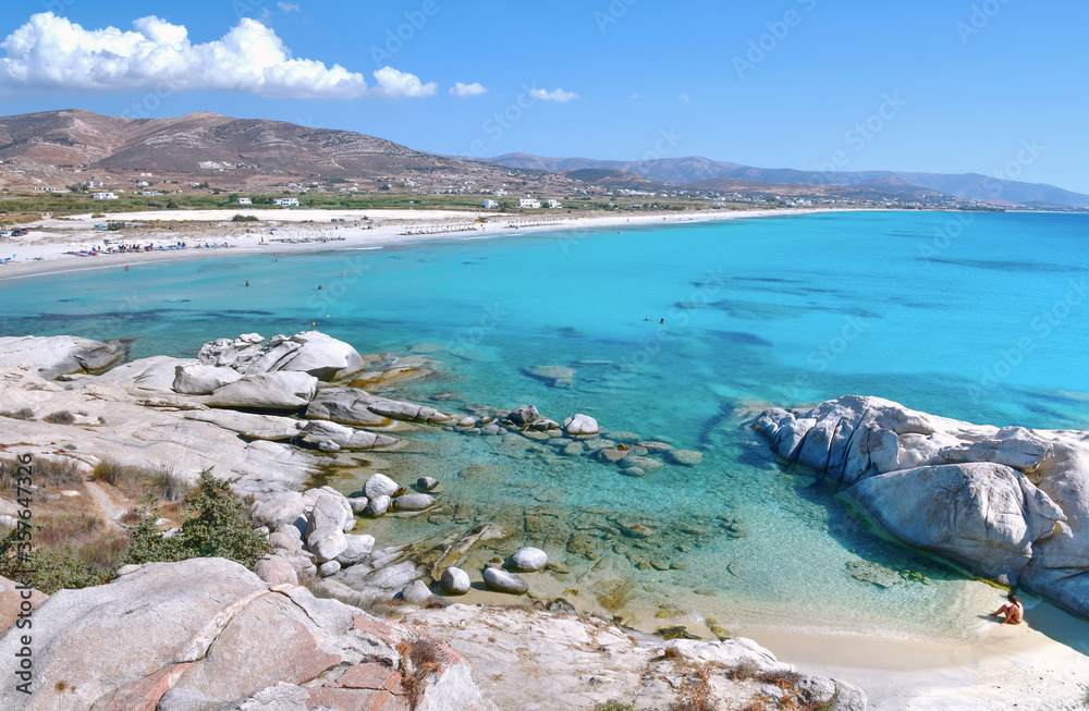 A beautiful beach with turquoise water on the coast of Naxos island in Greece.