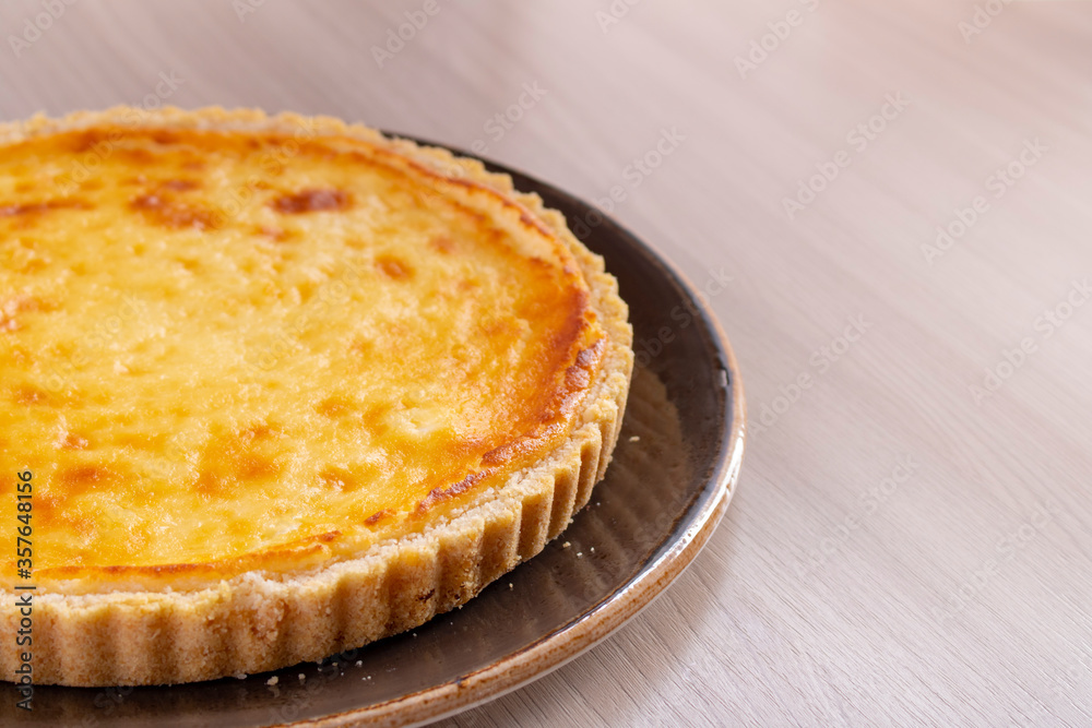 Pie with curd on the tray, top view. Place for text Pie with curd on the tray, top view. Place for text