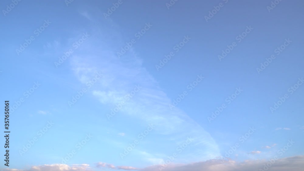 White clouds, clear soft sky, slow formation of cloudy landscape in the horizon, beautiful summer sunny day, colorful weather.