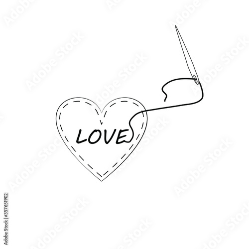 Pincushion in the shape of a heart with the inscription love