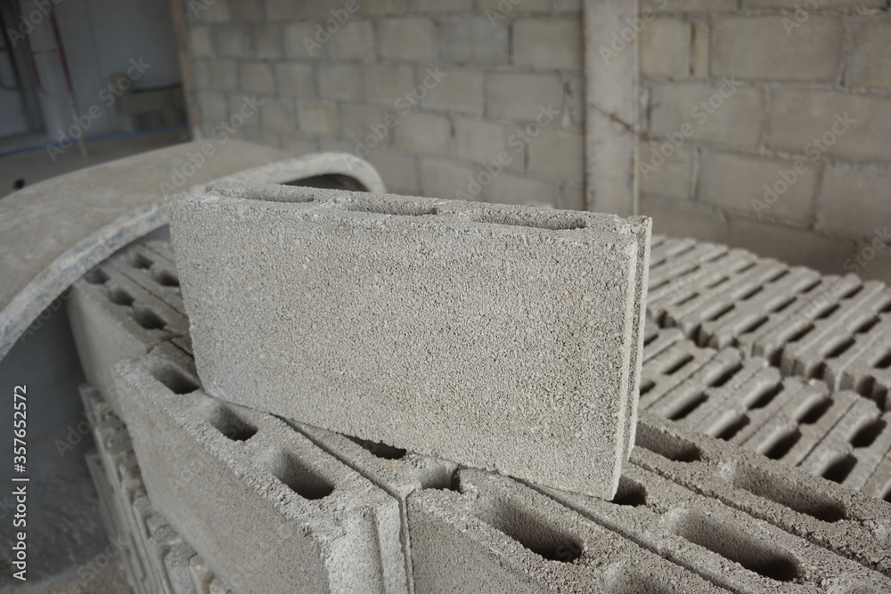 Cement blocks on construction site. Concrete block is made from a mixture of cement and stone and sand. It can bear high compressive strength.