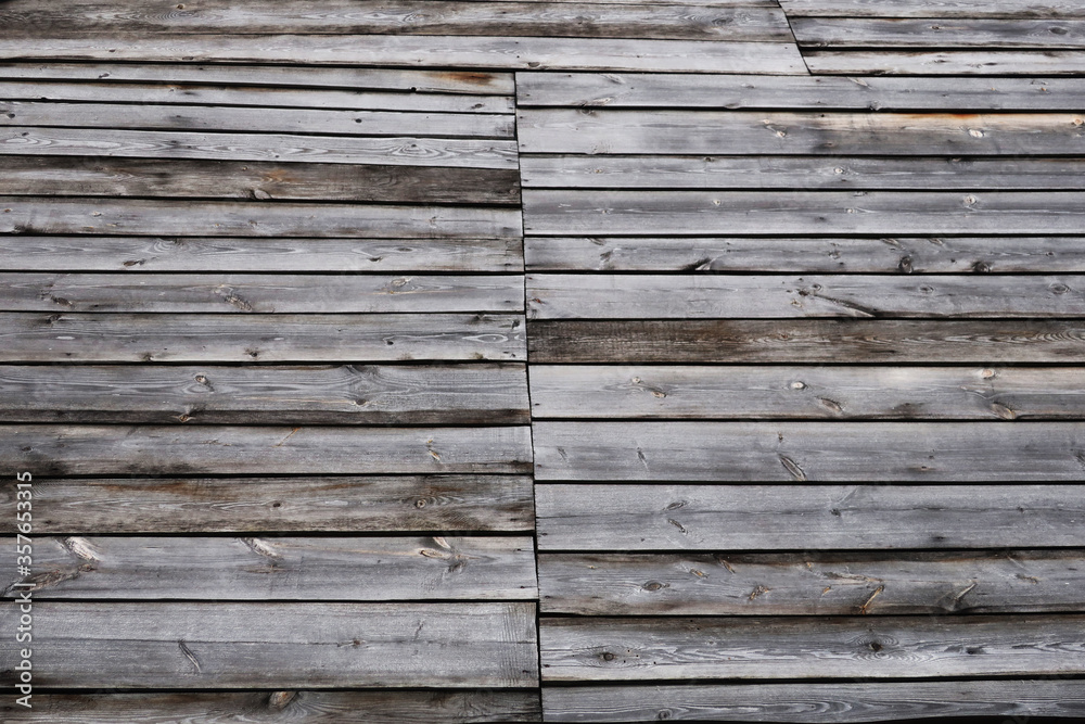 Obraz premium Textured background from an old wooden fence. Solid wood texture
