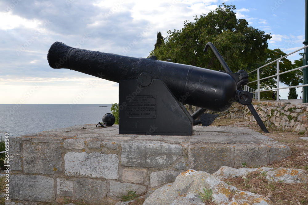 Old cannon against the background of the sea in Porec