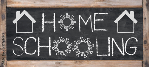 HOMESCHOOLING - Old rustic blackboard with wooden frame, white lettering and copy space
 photo