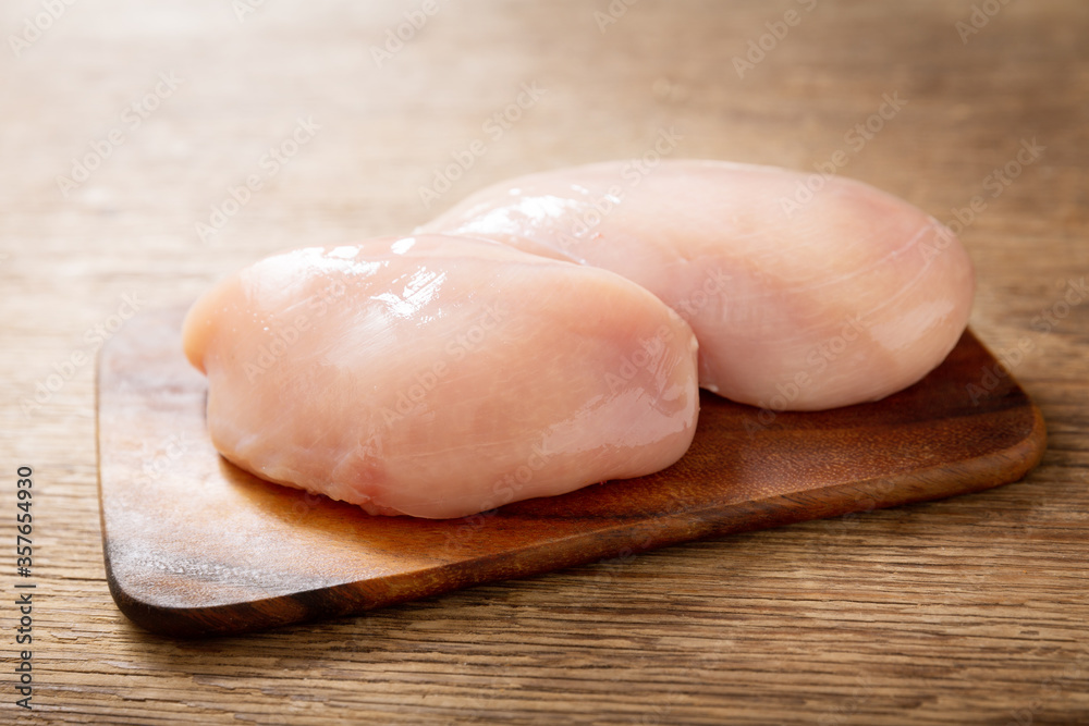 fresh chicken fillet on wooden table fresh chicken fillet on wooden table