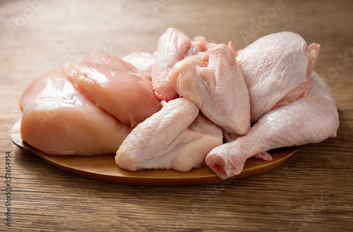 fresh chicken meat on a wooden board photo