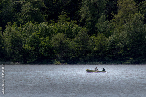 Two persons sitting in a rowboat