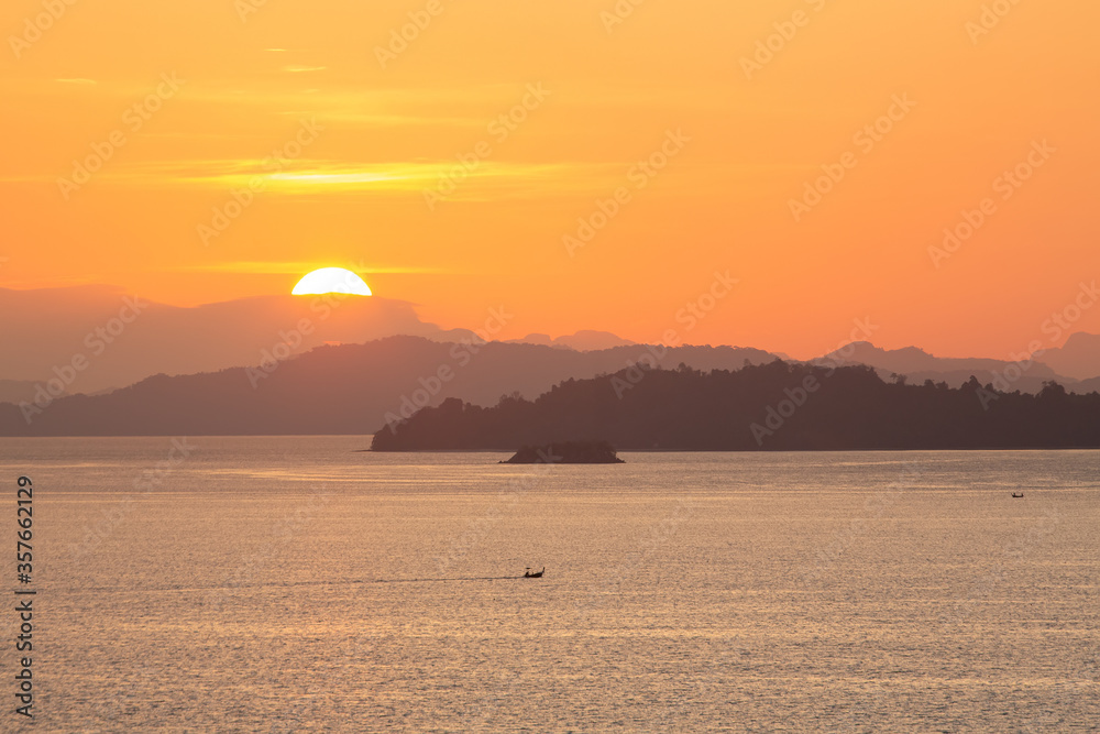 dawn over the mountains in the sea