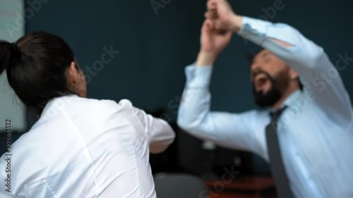 Business people fighting boxing relieves stress in the office woman taking victory on man. Psychological state concept. Business concept. Prores 422.