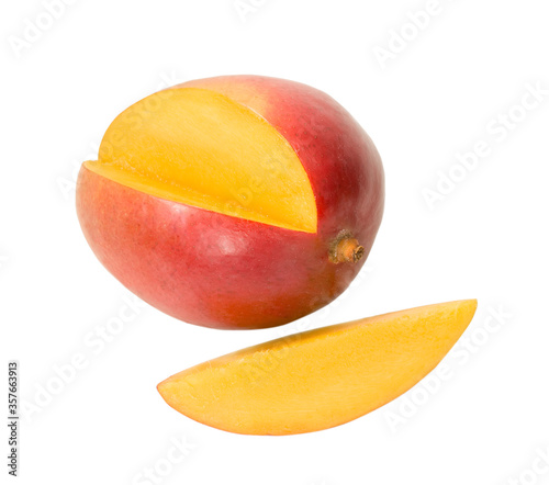 fresh mango with its yellow slice