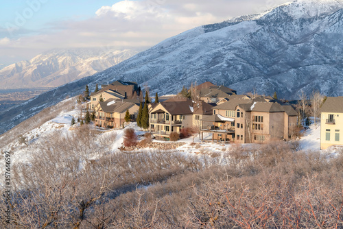 Winter in Utah with snowy Wasatch Mountains and lovely mountain homes views © Jason