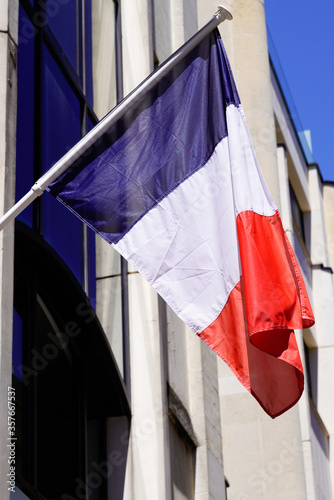 french blue white red flag of france on city hall building