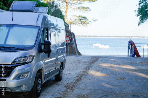 Motorhome RV campervan parked on a beach for night