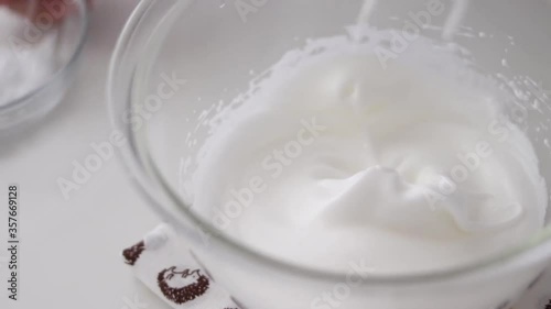Beat egg whites with sugar for dessert 