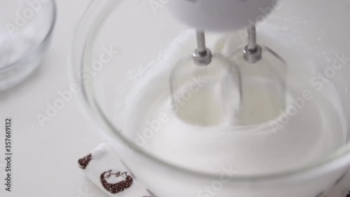 Beat egg whites with sugar for dessert 