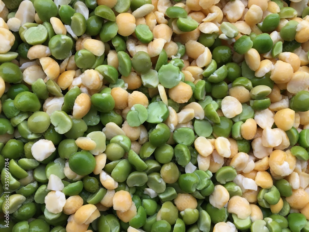 Mix of yellow and green peas. Gastronomic background for the design of the kitchen, cafe, shop window and restaurant. Mix of yellow and green peas. Gastronomic background for the design of the kitchen, cafe, shop window and restaurant.