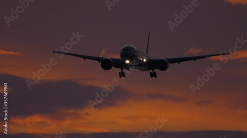 Wallpaper Mural Airplane approaching over ocean at sunset backgfround Torontodigital.ca