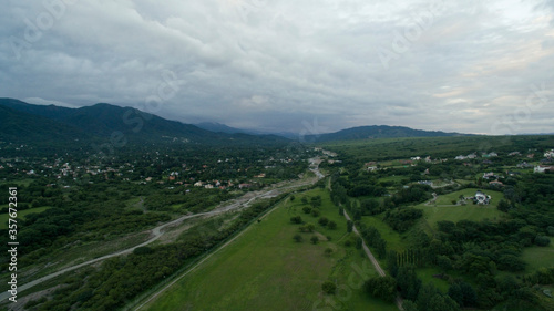 Rural landscape. Aerial view of the suburbs in Salta, Argentina. The valley, fields, forest and mountains at nightfall. 