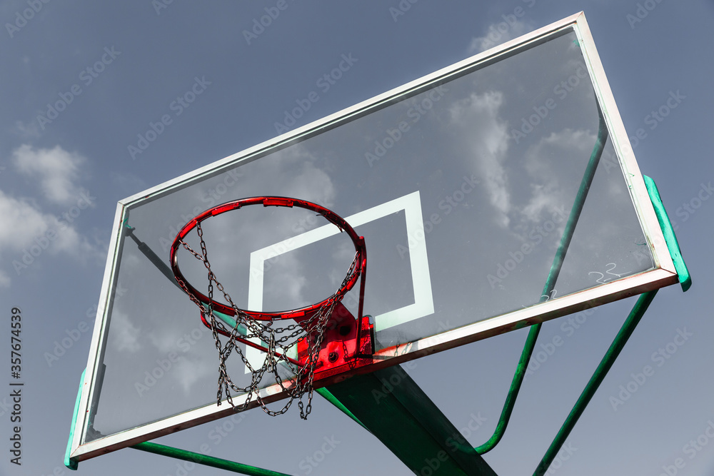basketball hoop against blue sky basketball hoop against blue sky