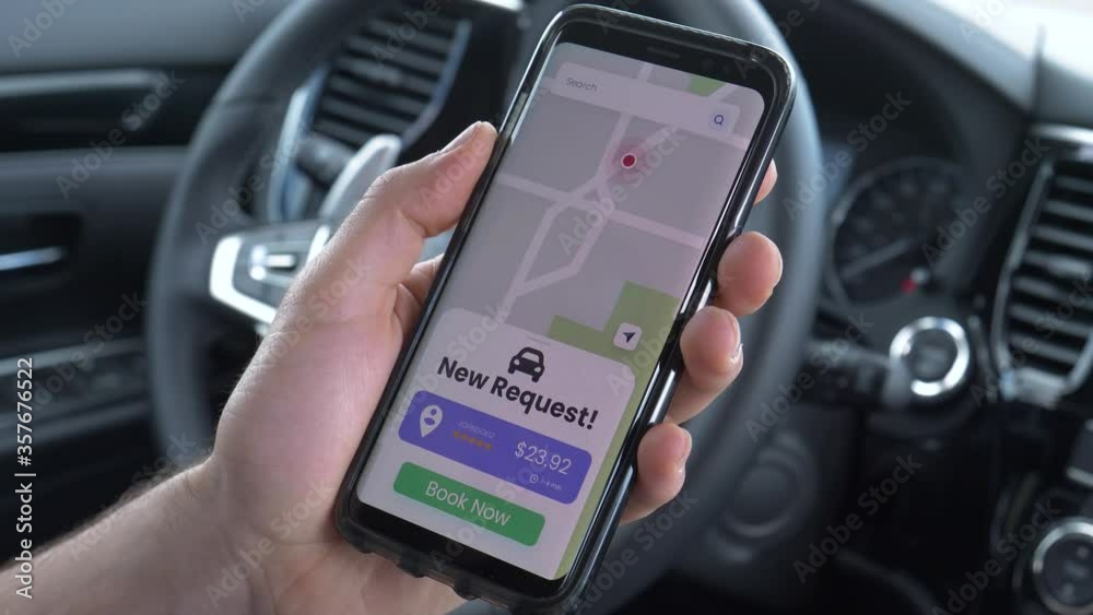 Ridesharing driver receiving a new request from a customer to get ...
